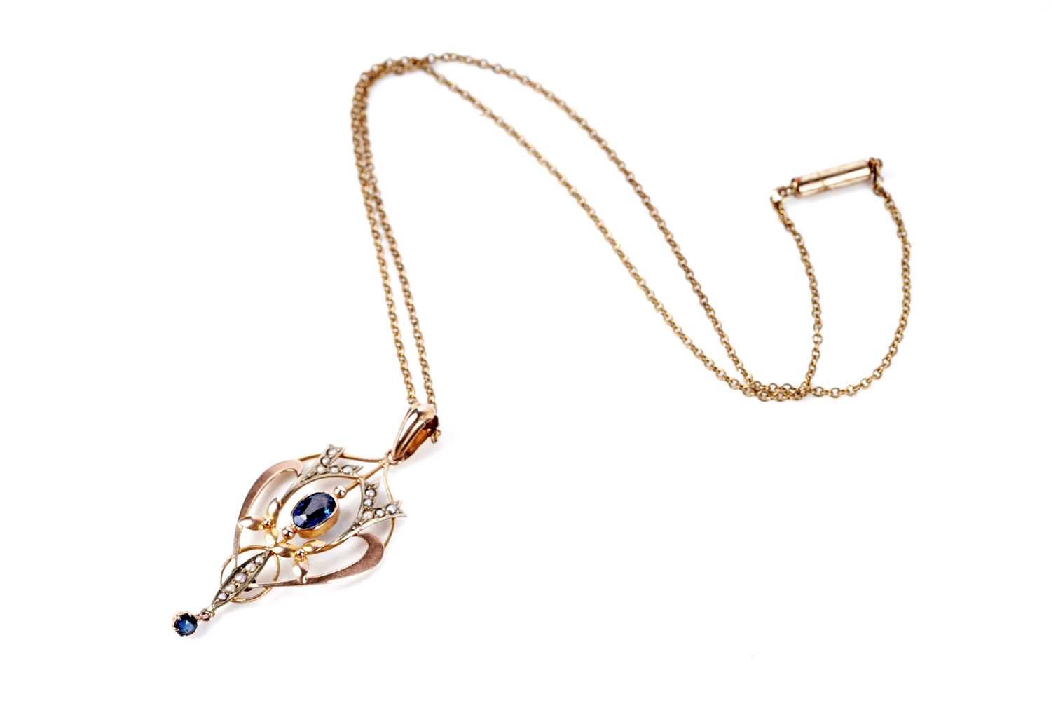Lot 197 - An Edwardian style gold drop pendant