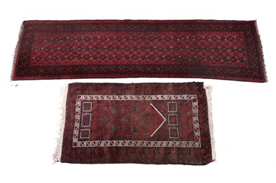 Lot 129 - An Afghan runner; and a Caucasian prayer mat