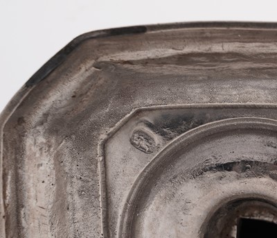 Lot 66 - A pair of William III silver cast candlesticks