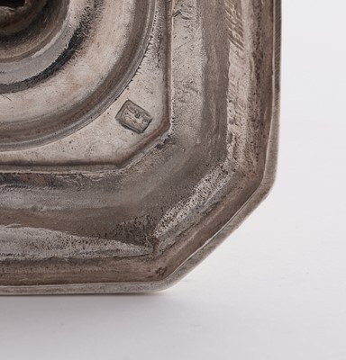 Lot 66 - A pair of William III silver cast candlesticks