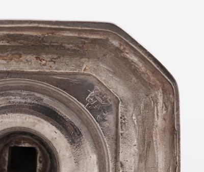 Lot 66 - A pair of William III silver cast candlesticks