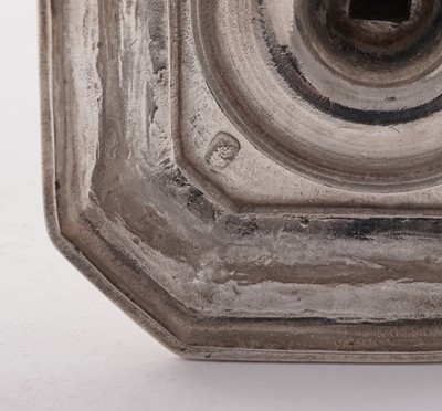 Lot 66 - A pair of William III silver cast candlesticks