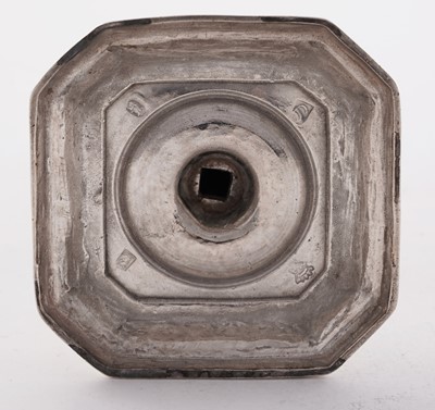 Lot 66 - A pair of William III silver cast candlesticks