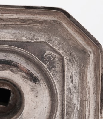 Lot 66 - A pair of William III silver cast candlesticks