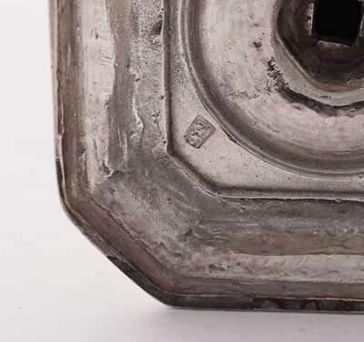 Lot 66 - A pair of William III silver cast candlesticks