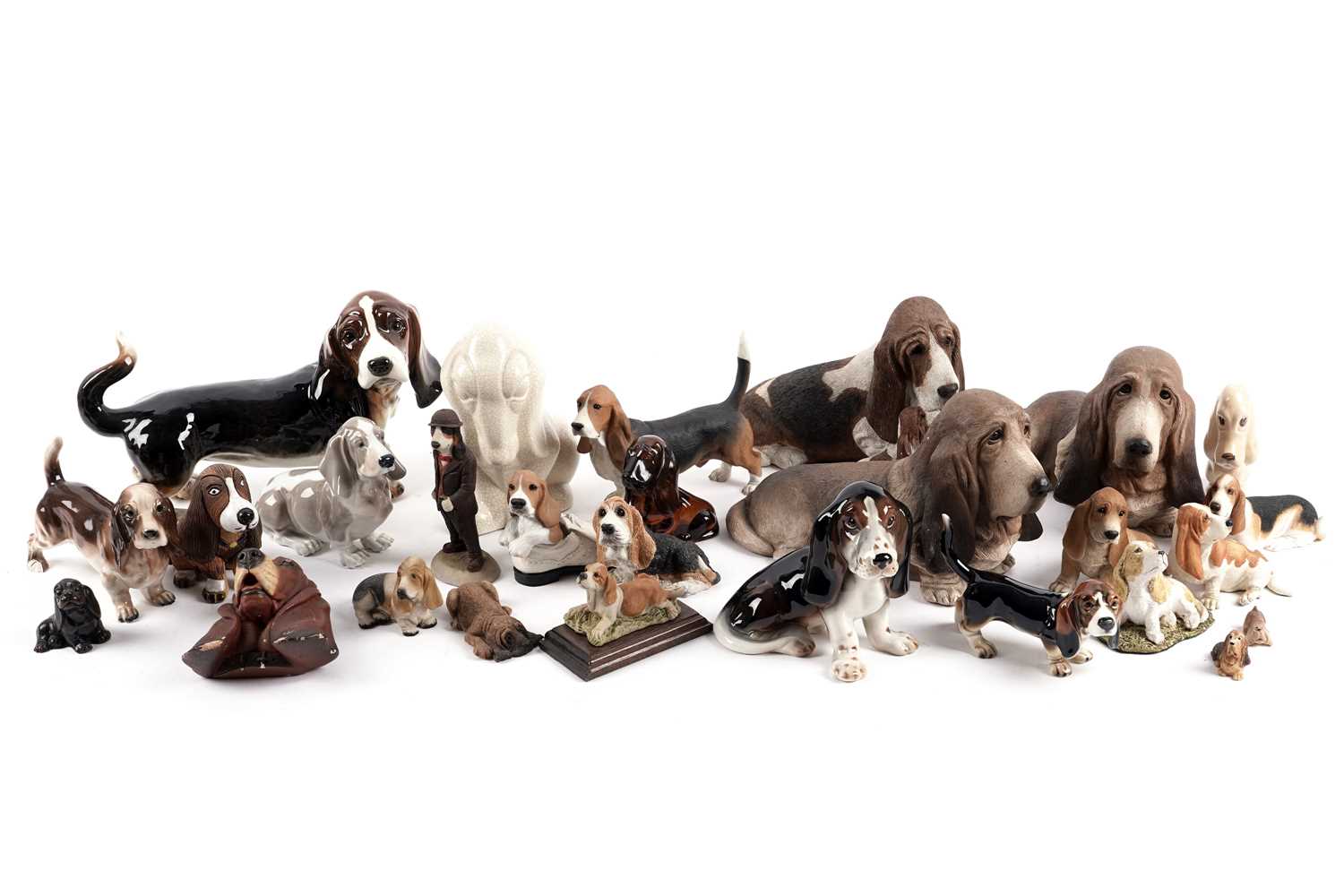Lot 349 - ﻿A collection of decorative ceramic and other figures of basset hounds
