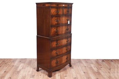 Lot 124 - A Georgian style mahogany bowfront chest on chest