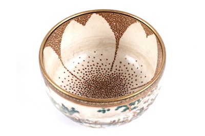 Lot 872 - A Japanese earthenware butterfly bowl