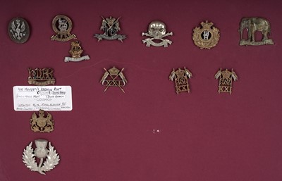 Lot 4 - A display of British Regimental cap badges
