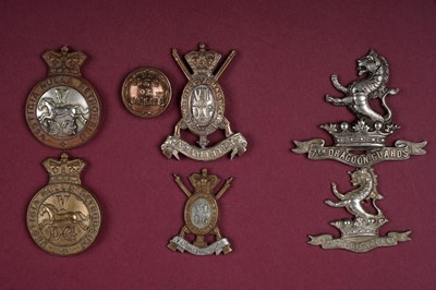 Lot 4 - A display of British Regimental cap badges