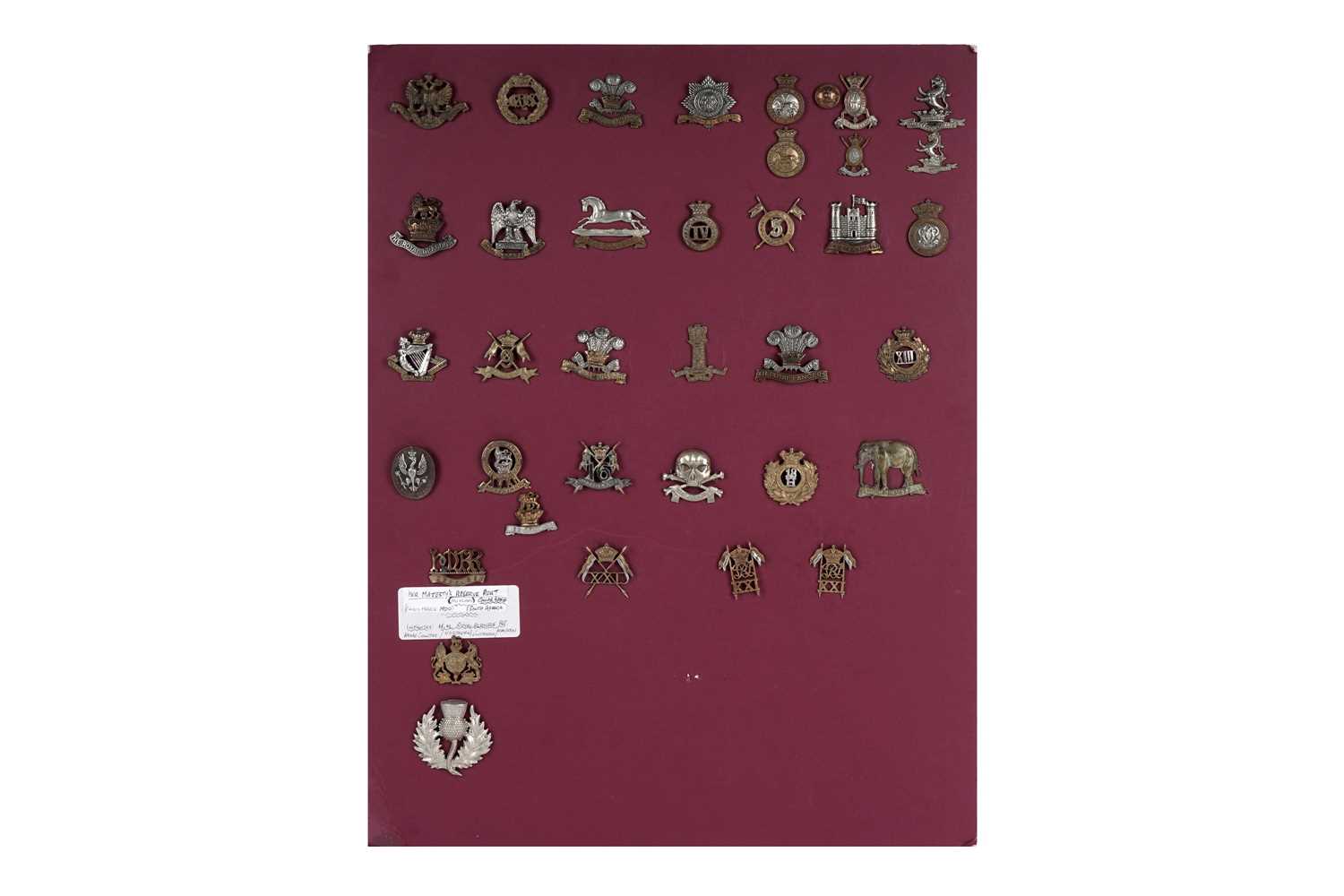 Lot 4 - A display of British Regimental cap badges