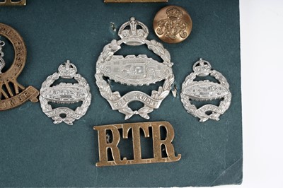 Lot 6 - A display of badges, titles and buttons for Dragoon, Hussar and Lancer regiments