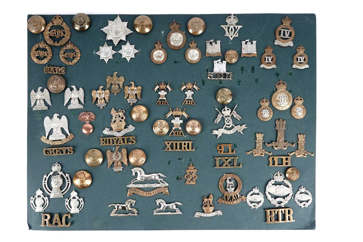 Lot 6 - A display of badges, titles and buttons for Dragoon, Hussar and Lancer regiments