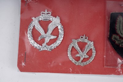 Lot 11 - A selection of cap, collar and other badges including: a scarce 1950's SAS beret badge