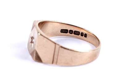 Lot 84 - A star set diamond signet ring; and a gold wedding band