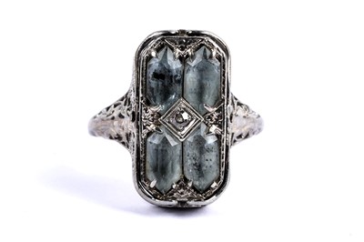 Lot 69 - An aquamarine and diamond swivel dress ring