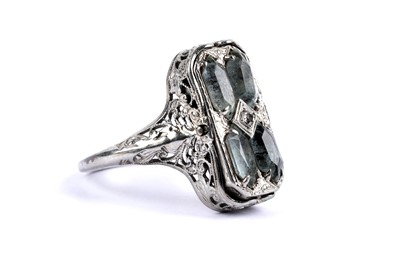 Lot 69 - An aquamarine and diamond swivel dress ring