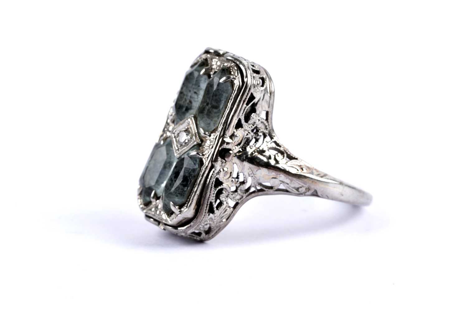 Lot 69 - An aquamarine and diamond swivel dress ring