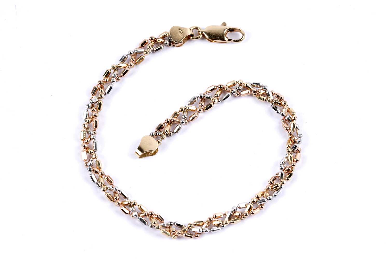Lot 67 - A tri-colour fancy link chain bracelet