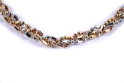 Lot 67 - A tri-colour fancy link chain bracelet
