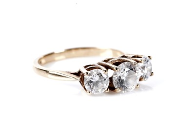 Lot 77 - A three stone dress ring; and a pair of stud earrings