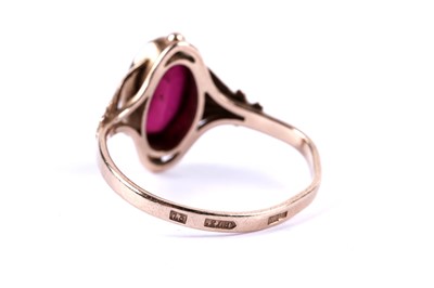 Lot 57 - A ruby and white stone cluster pendant; and a ruby single stone ring