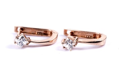 Lot 64 - A pair of ruby drop earrings; and a pair of princess cut CZ earrings