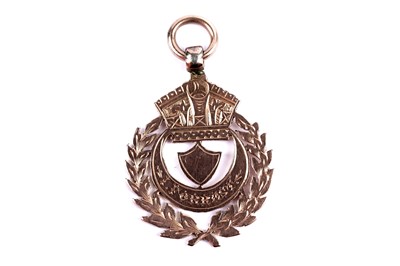 Lot 8 - An Edwardian 9ct rose gold fob medal; and another