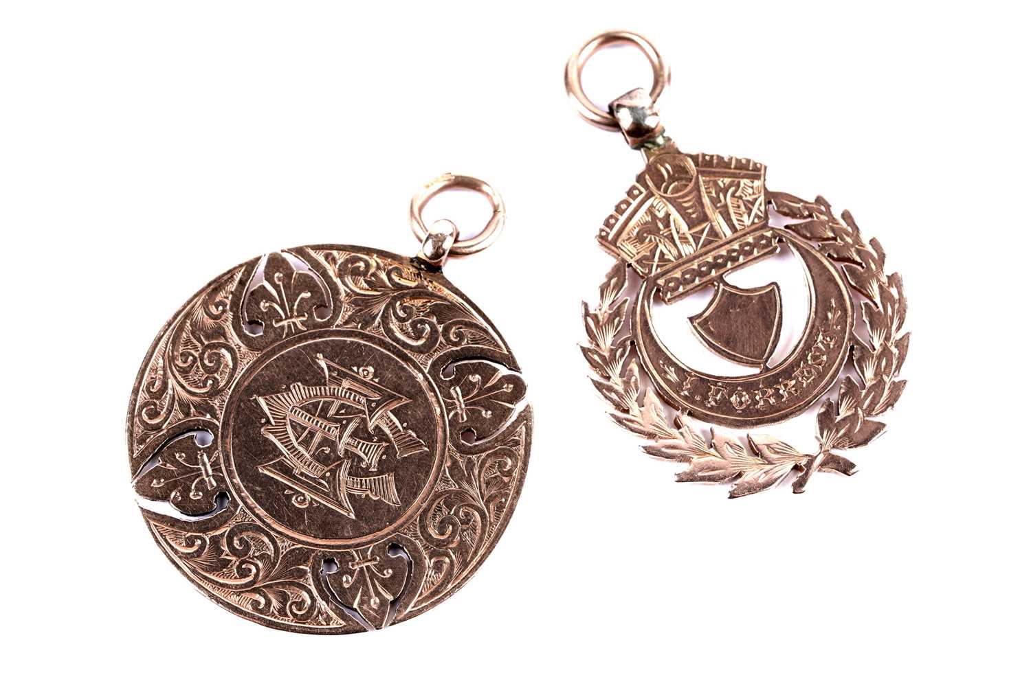 Lot 8 - An Edwardian 9ct rose gold fob medal; and another