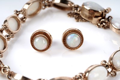 Lot 73 - An opal cabochon bracelet; and a pair of opal stud earrings