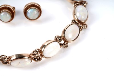Lot 73 - An opal cabochon bracelet; and a pair of opal stud earrings