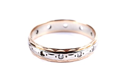 Lot 12 - A citrine cocktail ring; and an eternity ring