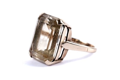 Lot 12 - A citrine cocktail ring; and an eternity ring
