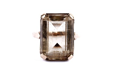 Lot 12 - A citrine cocktail ring; and an eternity ring