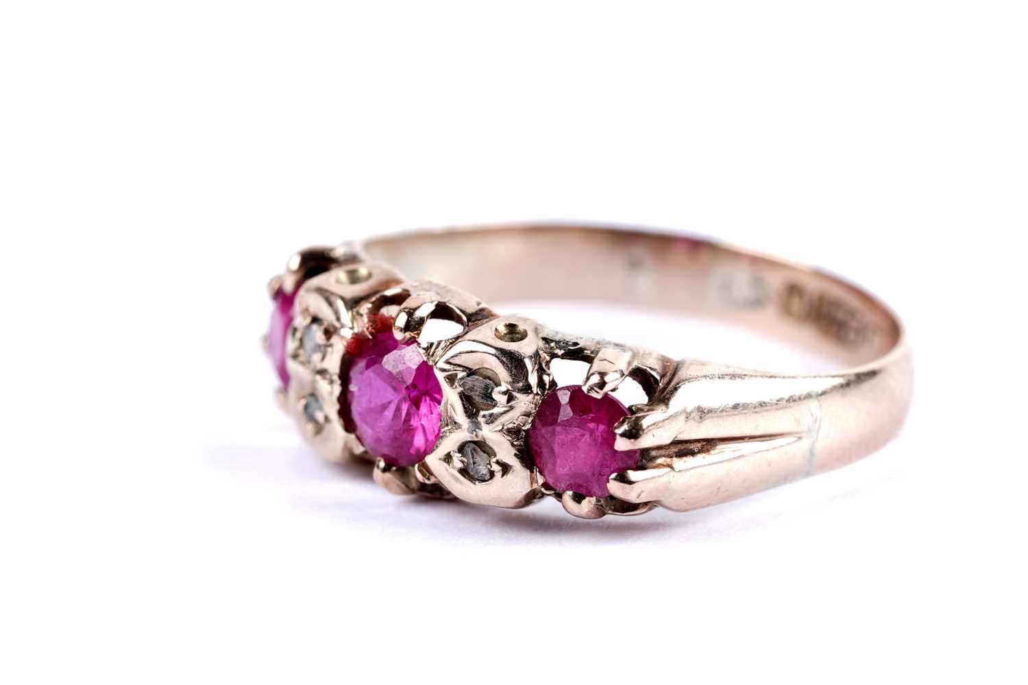 Lot 14 - A ruby and diamond dress ring