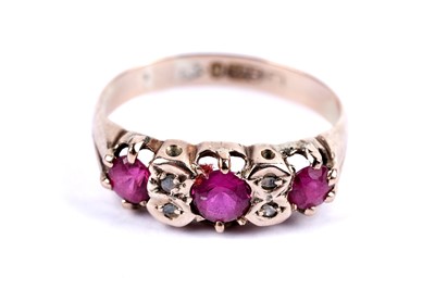 Lot 14 - A ruby and diamond dress ring