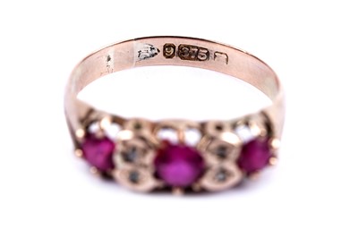 Lot 14 - A ruby and diamond dress ring