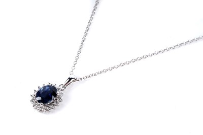 Lot 132 - A sapphire and diamond cluster pendant necklace