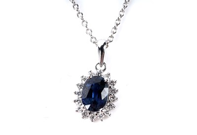 Lot 132 - A sapphire and diamond cluster pendant necklace