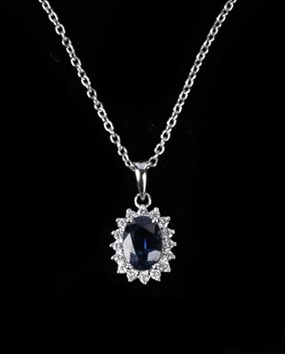 Lot 132 - A sapphire and diamond cluster pendant necklace