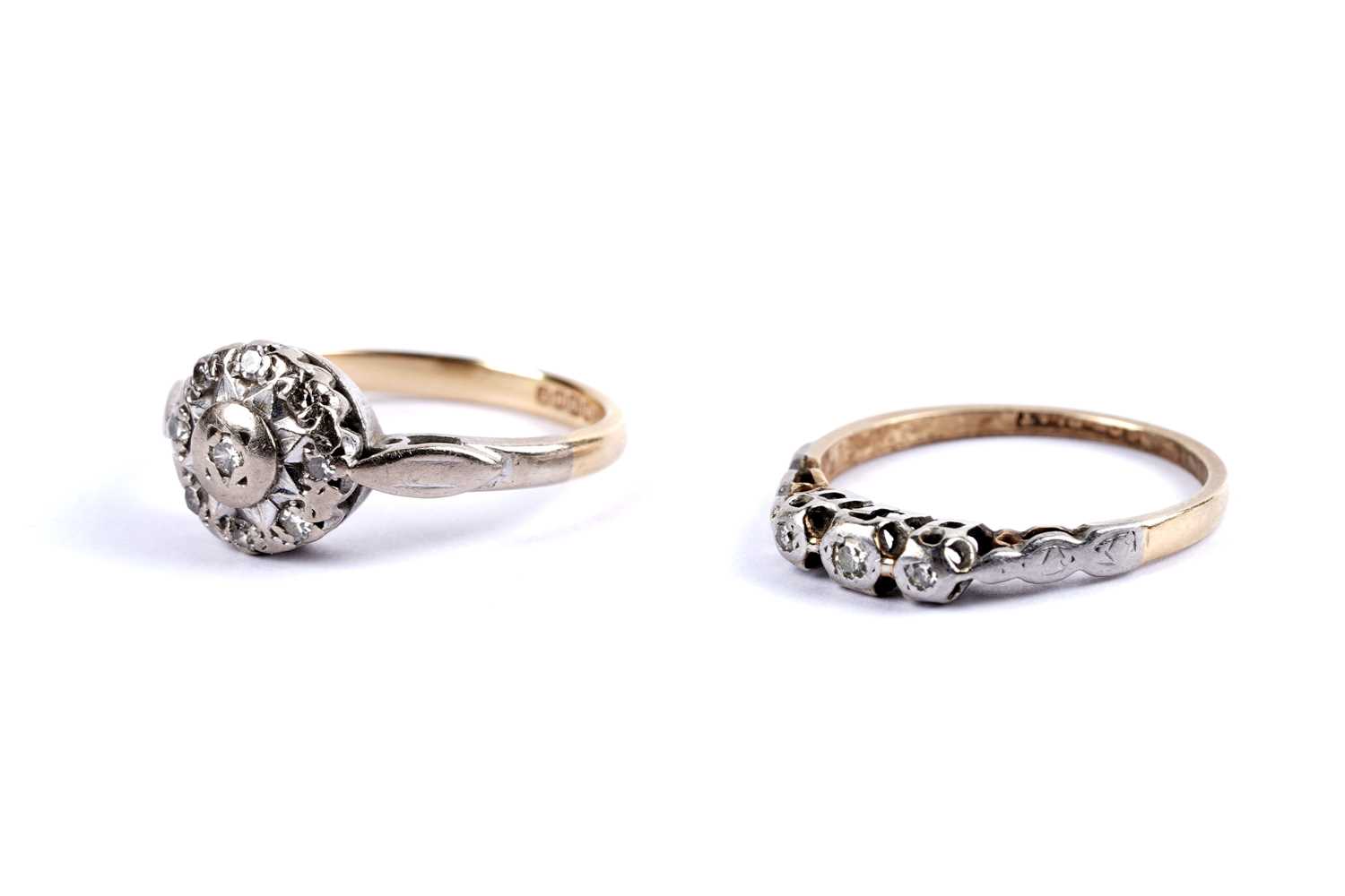 Lot 113 - A diamond cluster ring; and a diamond three stone ring