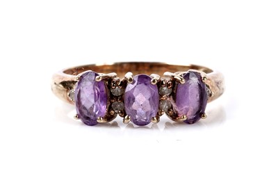 Lot 122 - An amethyst and diamond dress ring