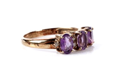 Lot 122 - An amethyst and diamond dress ring