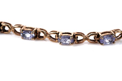 Lot 128 - A tanzanite tennis bracelet