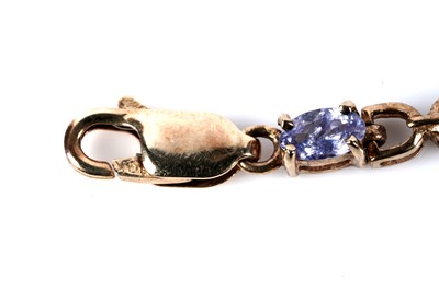 Lot 128 - A tanzanite tennis bracelet