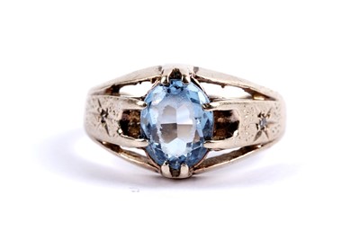 Lot 112 - A blue stone and diamond ring