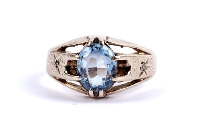 Lot 112 - A blue stone and diamond ring