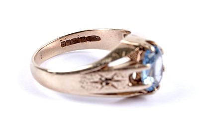 Lot 112 - A blue stone and diamond ring
