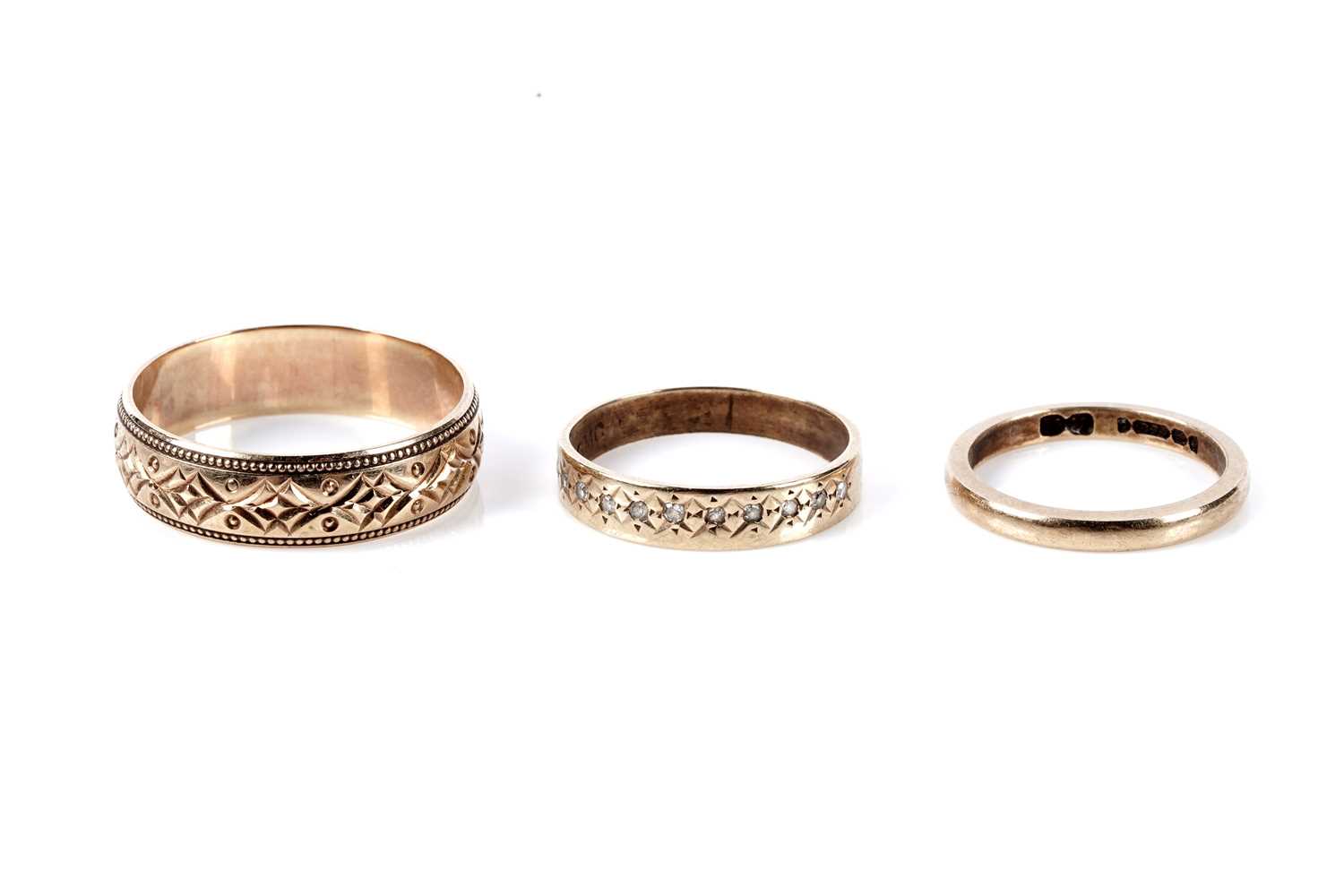 Lot 124 - Two 9ct gold wedding rings; and another