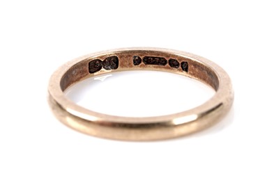 Lot 124 - Two 9ct gold wedding rings; and another